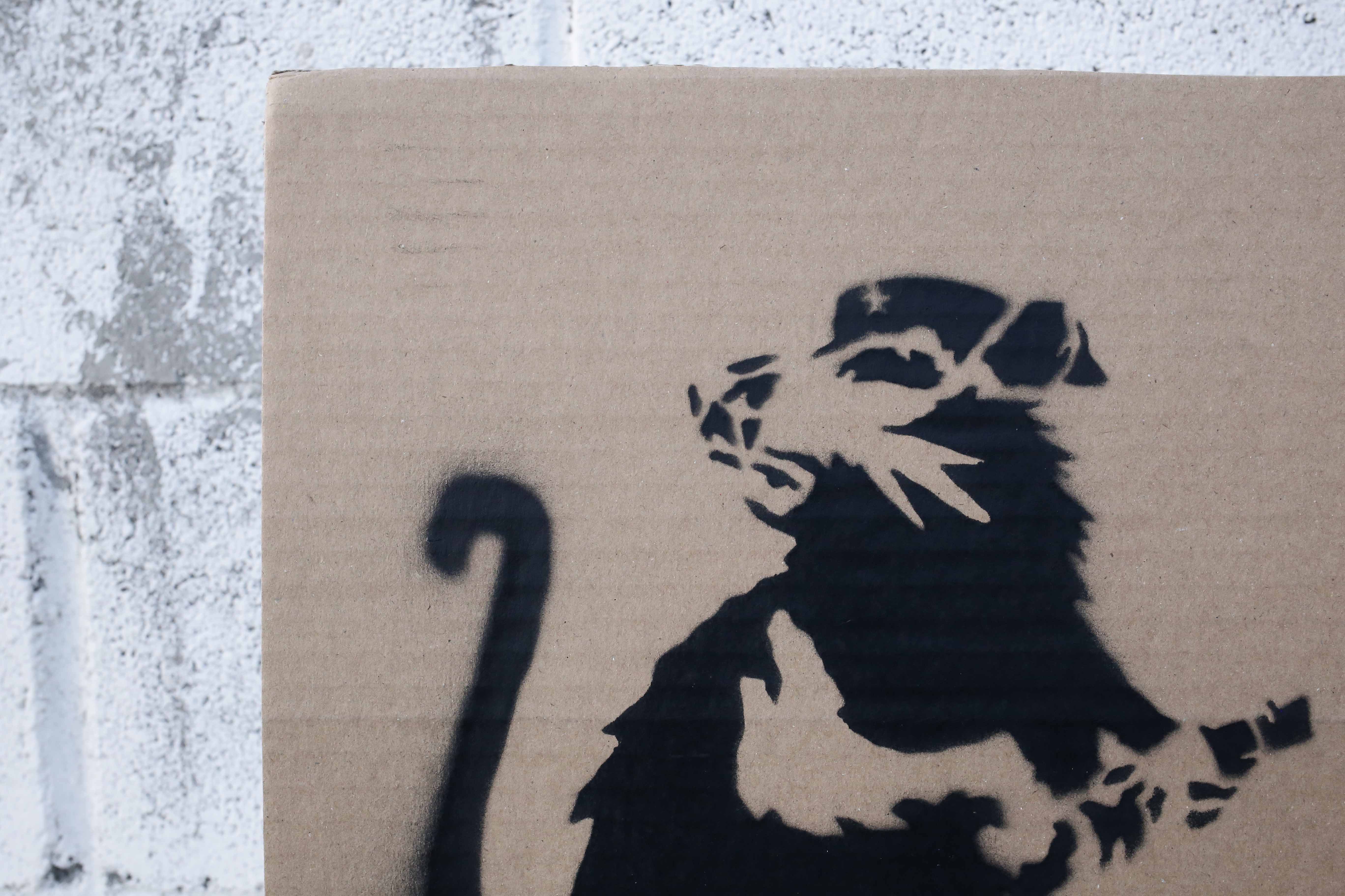 Banksy  Spray paint and stencil on cardboard, signed and numbered